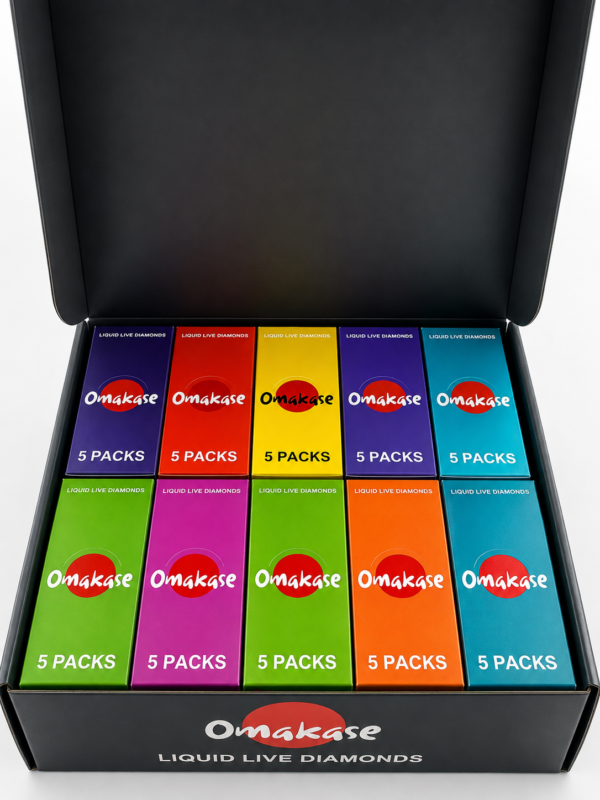 Omakase 2G Triple Tank All-in-One wholesale master case exterior in matte black showing Omakase logo with red circle, 50 PACKS text, 2.0G TRIPLE TANK ALL-IN-ONE product name, 2.0G net weight, and California cannabis compliance warning on the front panel.