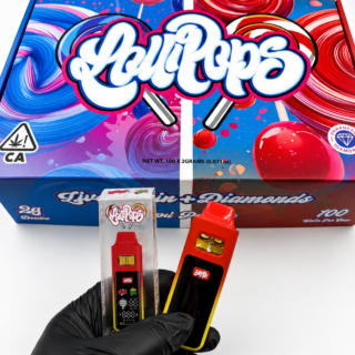 Lollipops Disposable 2G Dual Chamber Vape wholesale display box exterior showing blue and red lollipop artwork, Live Resin plus Diamonds label, Dual Flavors text, and California cannabis warning seal with NET WT 100 x 2GRAMS printed on bottom panel.