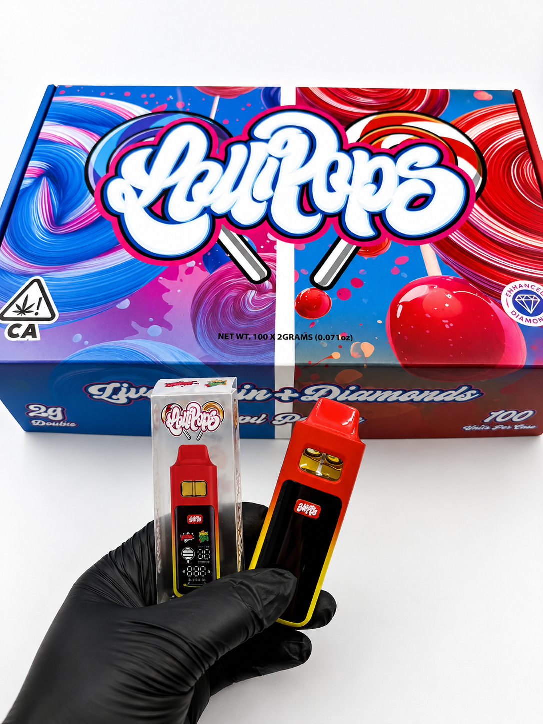 Lollipops Disposable 2G Dual Chamber Vape wholesale display box exterior showing blue and red lollipop artwork, Live Resin plus Diamonds label, Dual Flavors text, and California cannabis warning seal with NET WT 100 x 2GRAMS printed on bottom panel.